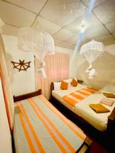 Postel nebo postele na pokoji v ubytování Sheran Safari House