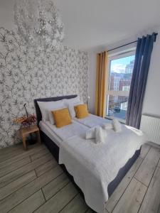Posteľ alebo postele v izbe v ubytovaní Old Town Yellow Apartment