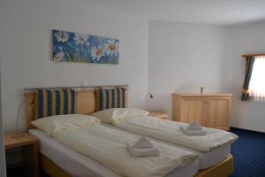 Postel nebo postele na pokoji v ubytování Hotel Allegra