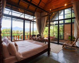 Postel nebo postele na pokoji v ubytování Cocoa Valley Resort