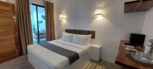 Ένα ή περισσότερα κρεβάτια σε δωμάτιο στο Villa Francine El Nido