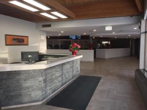 The lobby or reception area at Grand Marshal Inn