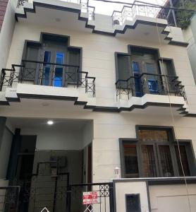 een wit gebouw met balkons en trappen erop bij 3bhk villa at koramangala in Bangalore