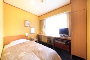 TV a/nebo společenská místnost v ubytování Niigata Station Hotel