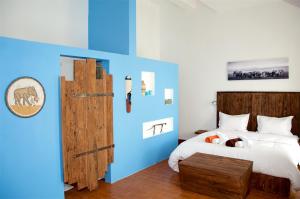 Un pat sau paturi într-o cameră la Villa Anakao Mauritius