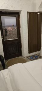 Voodi või voodid majutusasutuse Riad Nizwa toas
