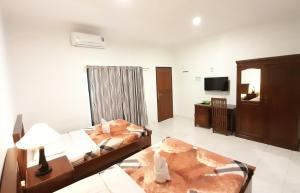 Кровать или кровати в номере Hotel Green Prundi