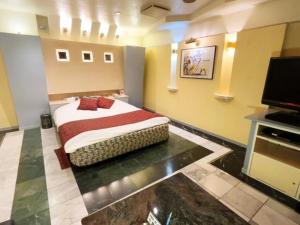Ένα ή περισσότερα κρεβάτια σε δωμάτιο στο HOTEL K's GOMANGOKU adult only