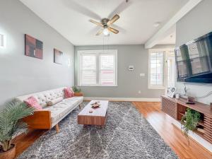 a living room with a couch and a flat screen tv at 3 bed 1 bath FREE parking near NYC in North Bergen