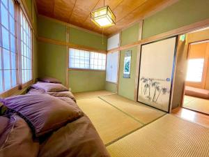 Postel nebo postele na pokoji v ubytování Private Lodge 春夏秋冬 -SHIKI- + 15 fotografií