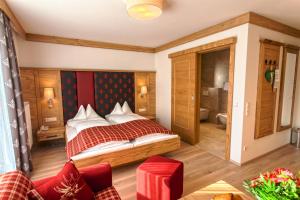 A bed or beds in a room at Sonnenhotel Zum Stern