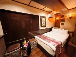 Postel nebo postele na pokoji v ubytování Hotel Gran Bali Resort + 32 fotografií