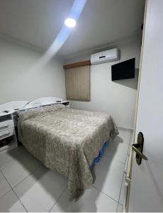 a hospital room with a bed and a light at ACONCHEGANTE Aptº NA PRAIA DE OLINDA in Olinda