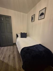 Postel nebo postele na pokoji v ubytování Bliss House