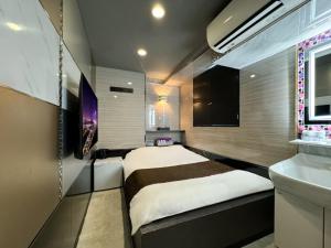 Postel nebo postele na pokoji v ubytování Hotel Amethyst + 37 fotografií