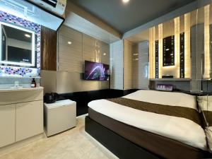 Postel nebo postele na pokoji v ubytování Hotel Amethyst