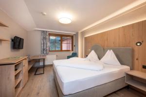 Posteľ alebo postele v izbe v ubytovaní Bliem's Familienhotel