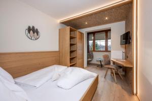 Posteľ alebo postele v izbe v ubytovaní Bliem's Familienhotel