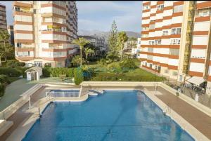 an overhead view of a swimming pool with buildings at Estudio Zurycris in Torrox Costa