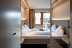 Posteľ alebo postele v izbe v ubytovaní Bliem's Familienhotel