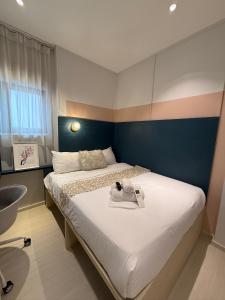 Postel nebo postele na pokoji v ubytování ISA Hotel Amber Road