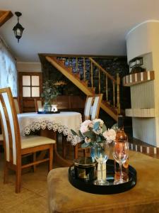 a room with a table with wine glasses and a staircase at Eden in Sędziszowa