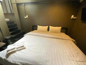 Postel nebo postele na pokoji v ubytování Capsule Hostel Chiangkhan