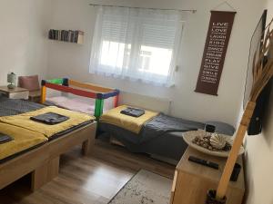 Postel nebo postele na pokoji v ubytování InOsijek- FEELS LIKE HOME