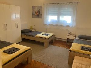 Postel nebo postele na pokoji v ubytování InOsijek- FEELS LIKE HOME