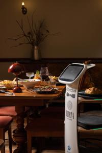 a table with avertisement for avertisementosateosateosateosateosateosateosateosate at OBERŻA POD RÓŻĄ restauracja, sauny, jacuzzi in Nowy Targ