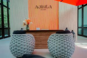 two white vases sitting in front of a salon at Ajinta Resort in Ko Kood