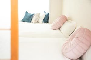 A bed or beds in a room at Miraie Yokkaichi Simizucho 2