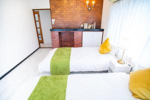 A bed or beds in a room at Miraie Yokkaichi Simizucho 2