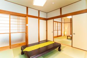 A bed or beds in a room at Miraie Yokkaichi Simizucho 2