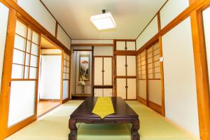 A bed or beds in a room at Miraie Yokkaichi Simizucho 2