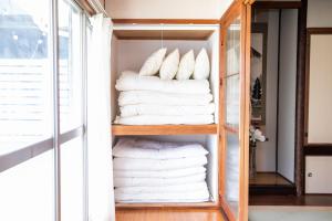 A bed or beds in a room at Miraie Yokkaichi Simizucho 2