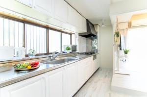 A kitchen or kitchenette at Miraie Yokkaichi Simizucho 2