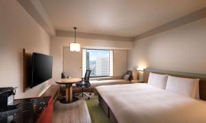 Кровать или кровати в номере Hilton Osaka Hotel