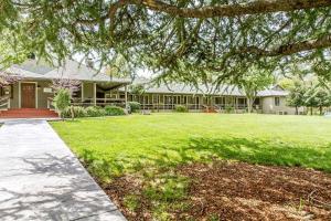 a house with a large yard in front of it at Sierra Sky Ranch in Oakhurst +57 photos