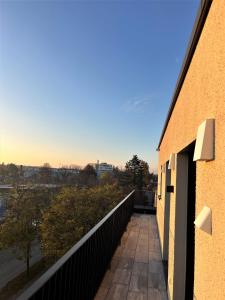 a balcony of a building with a view of a city at Mikes Apartments Munich in Munich
