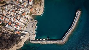 an aerial view of a harbor with water and buildings at Rea Boutique Apartments in Agia Galini