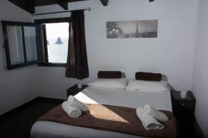 Postel nebo postele na pokoji v ubytování Ionian Perl Coast