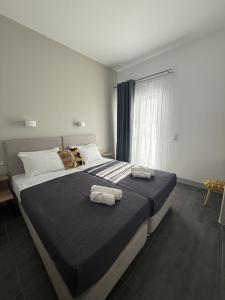Posteľ alebo postele v izbe v ubytovaní Dilion Hotel