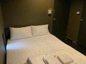 Postel nebo postele na pokoji v ubytování Capsule Hostel Chiangkhan