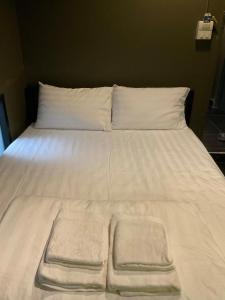 Postel nebo postele na pokoji v ubytování Capsule Hostel Chiangkhan