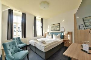 Postel nebo postele na pokoji v ubytování Hotel Meereseck