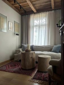 a living room with a couch and a coffee table at Villa Vena in Zakopane
