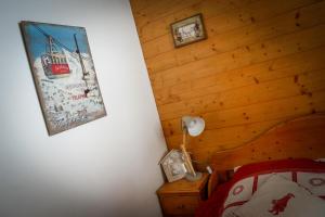 Ένα ή περισσότερα κρεβάτια σε δωμάτιο στο T2 Meublé Tourisme 3 etoiles, pied des pistes-parking privé avec balcon et superbe vue