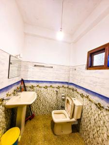 a bathroom with a toilet and a sink at Ella Rock Glance in Ella +51 photos
