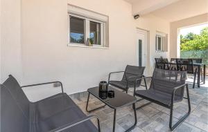 a waiting room with chairs and a table at 2 Bedroom Cozy Apartment In Zaboric in Zaboric +16 photos